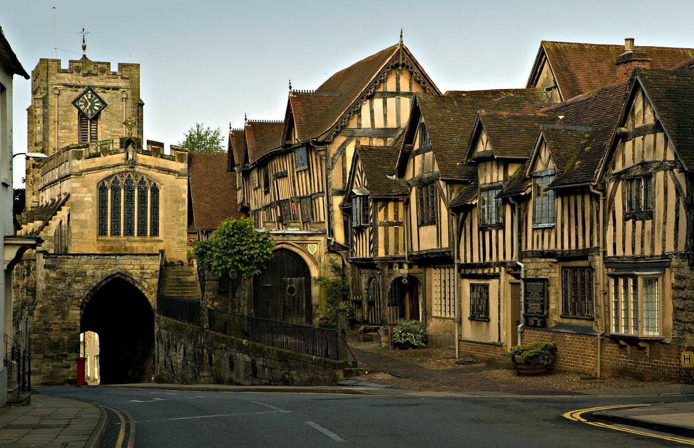 The timber-framed Lord Leycester Hospital and West Gate chapel in Warwick at dusk